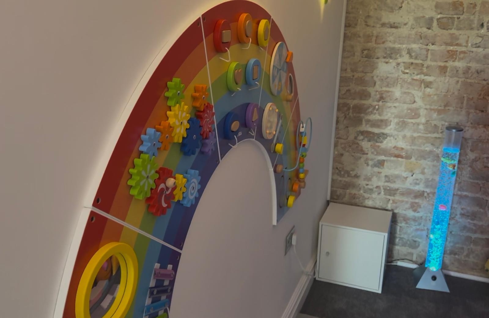 Victoria House sensory room rainbow activity wall
